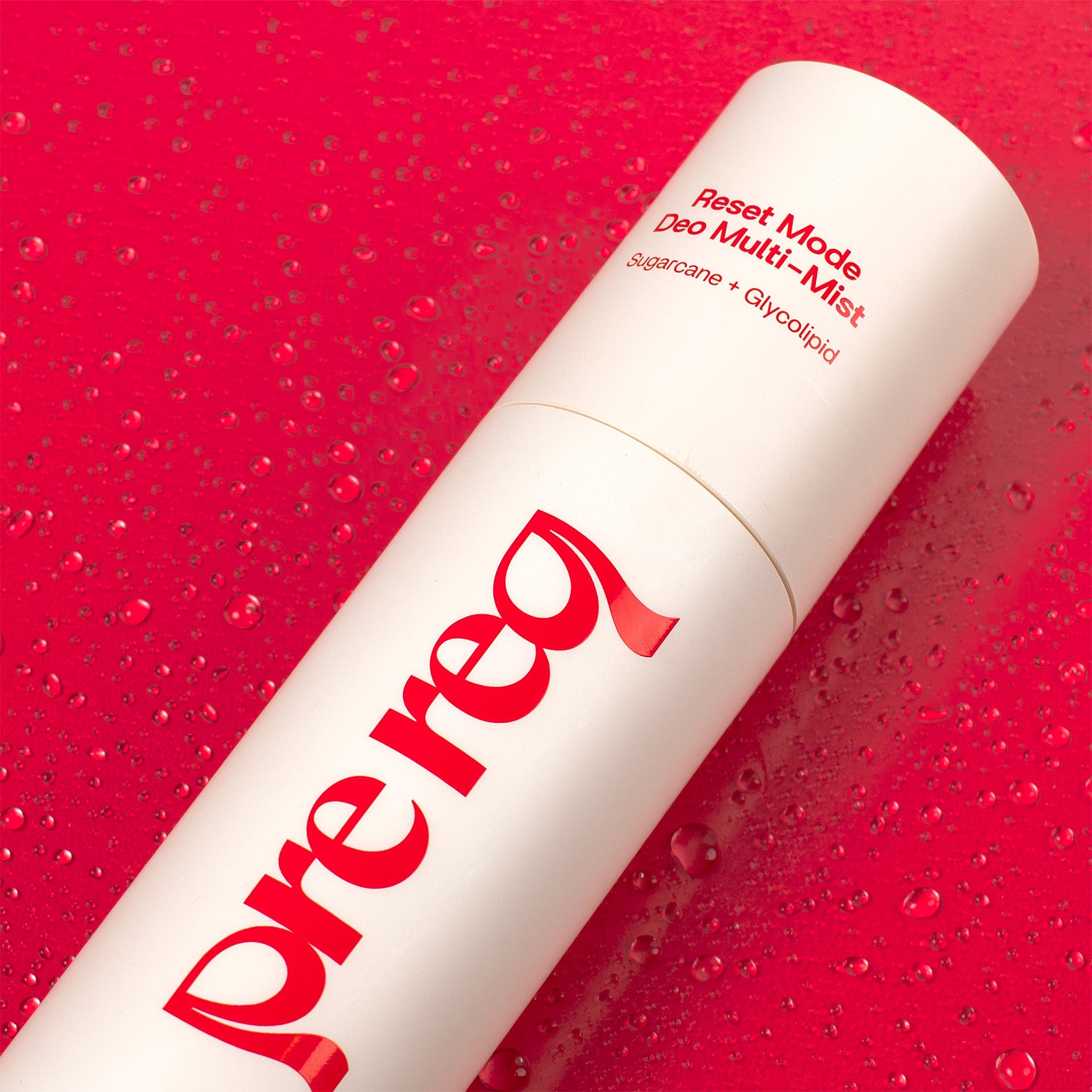 White deodorant spray bottle with red text on a red background name Prereq