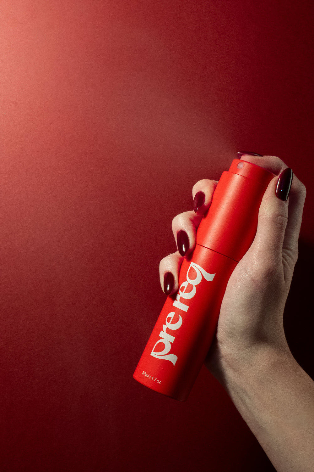 spraying hydromist red background and nails